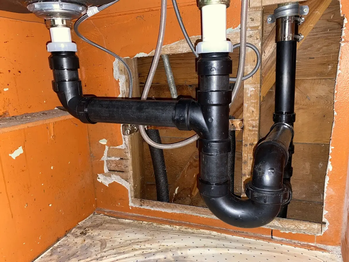 Professional Garbage Disposal Repair equipment and tools on the job in Pittsboro